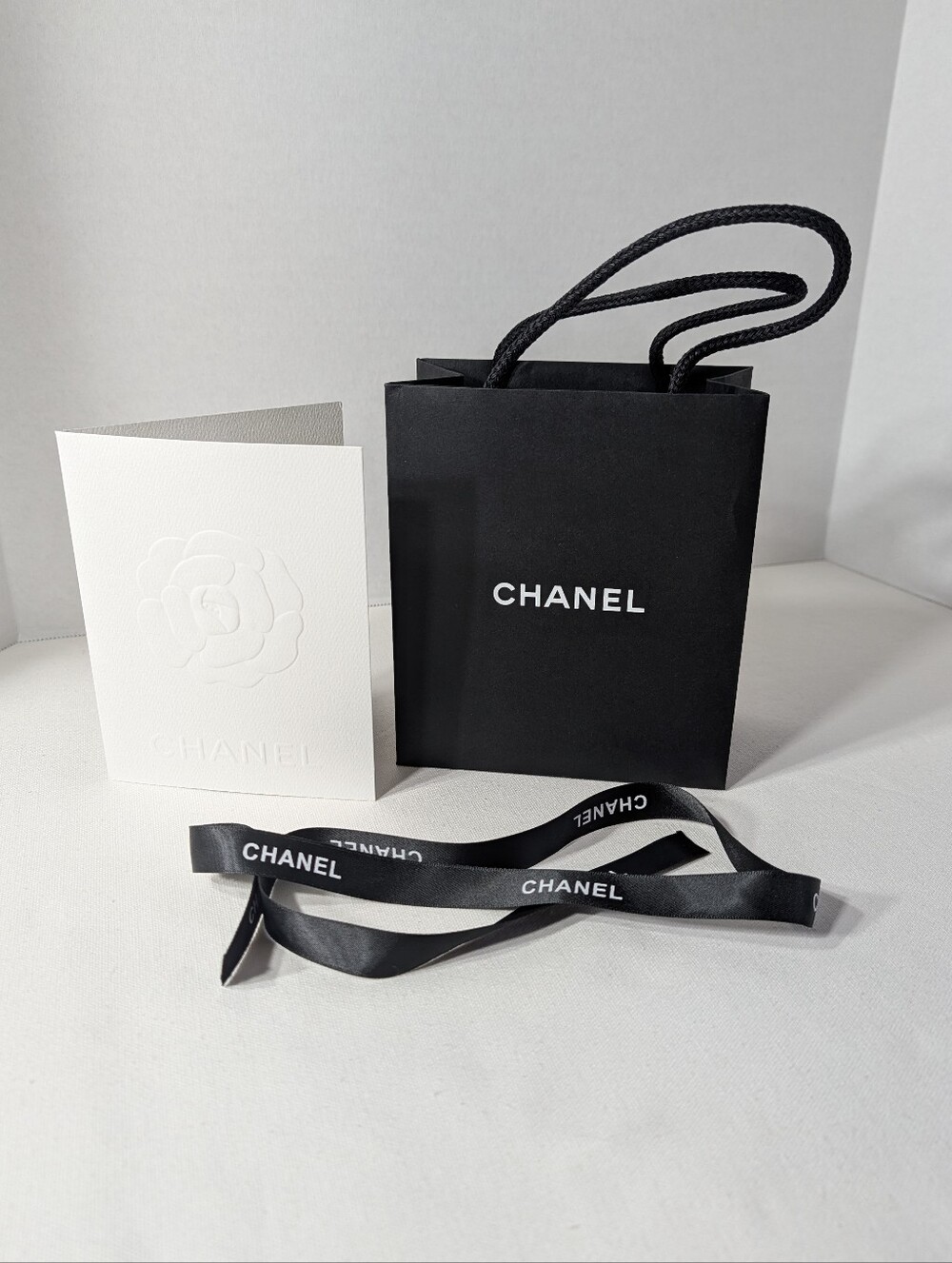 CHANEL Black Gift Bag with White Logo and Ribbon